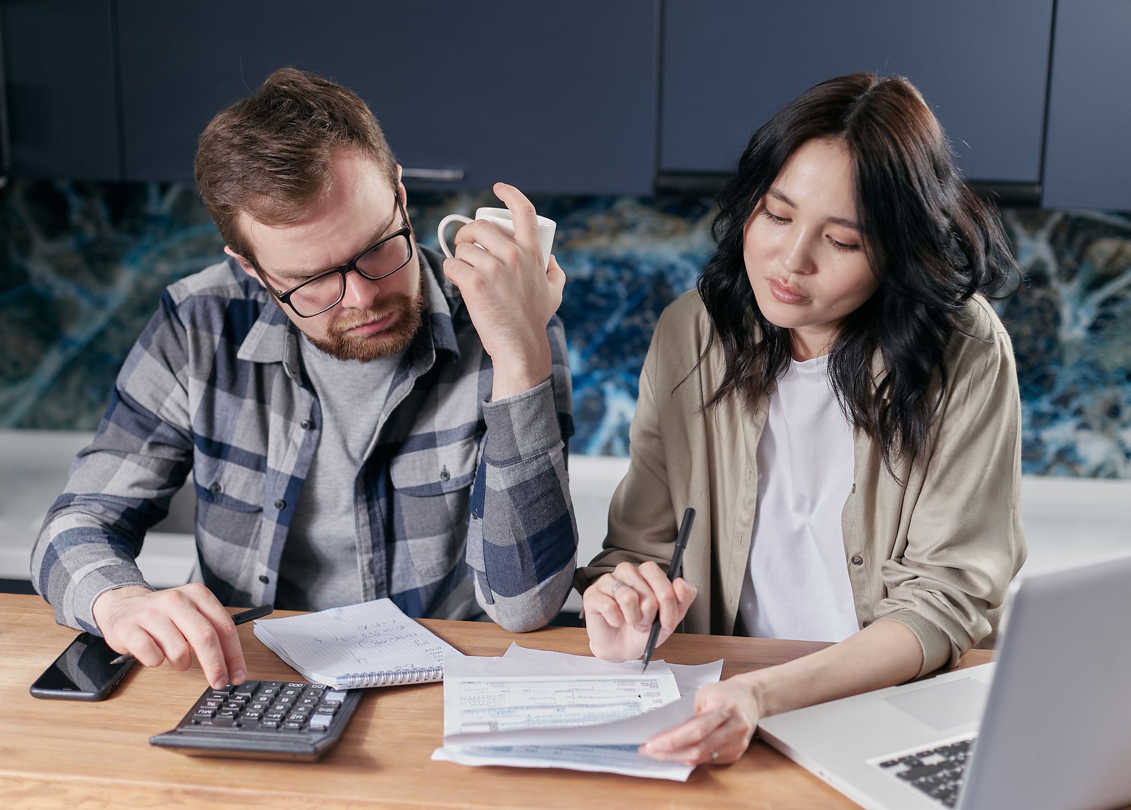 A couple reviewing household figures together