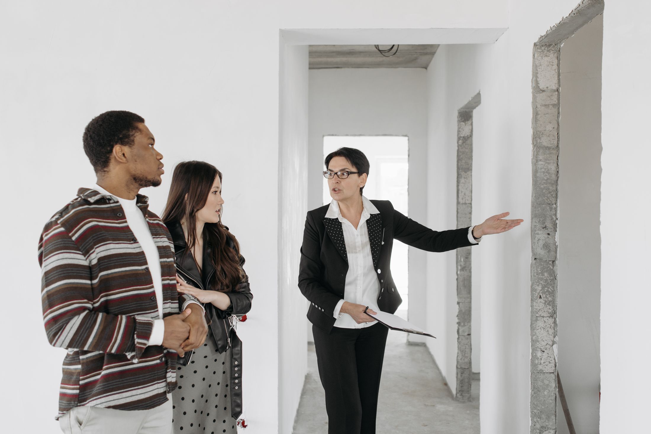 Prospective buyers walking through a home